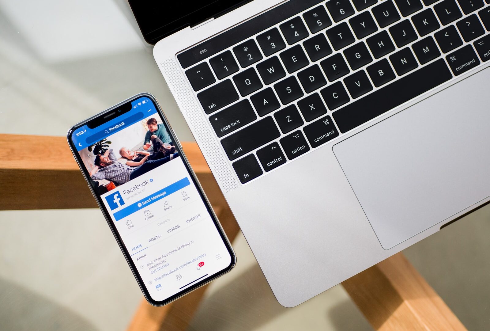 iPhone X beside MacBook